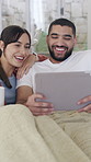 Smile, couple and relax with tablet in home on social media, browsing website and watching movies. Happy, people and digital for streaming, funny film and bonding together for weekend break in lounge