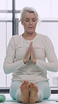 Morning, breathe and mature woman in home with prayer hands for stretching, mobility and balance. Yoga mat, house and person with pose for holistic exercise for health, wellness and peace on floor