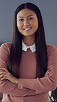 Marketing, face or Asian woman in office with arms crossed, pride or job in advertisement industry. Portrait, laugh or brand specialist in agency with confidence, work or experience as media planner
