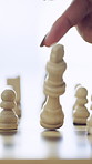 Hand, person and chessboard with king for checkmate victory, winning move and strategy success. Woman, tipping and chess piece for achievement, defeat opponent and game over with tournament milestone