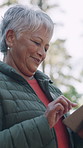 Smile, old woman and hiking with tablet outdoor for research, social media and adventure. Bokeh, lens flare and senior person with tech for browsing internet, travel navigation and check notification