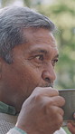 Happy, senior man and drinking coffee in morning, wellness and relax with hot drink. Outdoor, pensioner and elderly person in garden, retirement home and herbal tea for health benefits and espresso