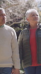Holding hands, walking and senior couple outdoor for fresh air, bonding and connection in neighborhood. Retirement, marriage and elderly man with woman for affection, love and relationship in morning