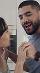 Couple, singing and happy in kitchen with juicer, connection and energy with pretend mic in home. Person, smile and voice for karaoke, play or holding hands for dancing with relationship at apartment