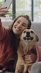 Happy, woman and selfie with dog, lounge and bonding on couch, kiss and photography for social media. Home, person and memory with domestic animal on break, laughing and picture with pet on sofa