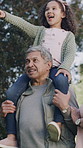 Happy girl, grandparents and nature with piggyback for bonding, holiday or outdoor weekend together. Grandma, grandpa and carrying granddaughter on shoulder for playful adventure or journey in park