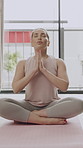 Morning, breathe and woman in home with prayer hands for meditation, mindfulness and balance. Yoga mat, house and person with pose for holistic exercise for health, wellness and calm energy on floor