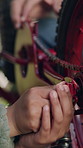 Hands, child and fixing bicycle for repairs, learning skills and transport safety at park. Smile, kid and person helping for bike maintenance, chain security and mechanic guidance for tyre puncture