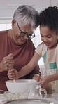 Girl, grandmother and happy with dough in kitchen for learning, baking or ingredients at family home. Elderly woman, child and teaching for cooking skills, bonding and helping hand with love at house
