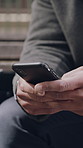Hands, cellphone and man in city, typing and digital app for social media, internet and message to contact. Online reading, outdoor and smartphone for communication, person and network for texting