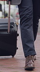 Legs, walk or businessman in city with suitcase, travel journey or attendance of corporate seminar. Trip, stroll or employee in town with luggage, office commute or flight for conference event.
