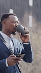 Business, cellphone and black man in city, drinking coffee and digital app for social media, smile or texting. Funny, herbal tea or smartphone for online comedy, person or message to contact or email