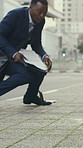 Drop, phone call and walking with business black man in city for accident or mistake on work commute. Fail, falling documents and overwhelmed with African employee outdoor for travel or trip