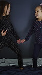 Sisters, children or happy with dancing on bed for wake up energy, bonding together or entertainment. Family, girl kids and movement with rhythm in home for morning fun, weekend break and connection