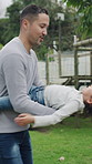 Flying, father and girl in backyard, playing and bonding together for love, fun and laughing. Outdoor, family and dad carrying daughter with game, energy and relationship with airplane and vacation