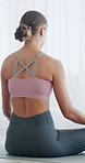 Woman, back and yoga with meditation in home for spiritual wellness or mental wellbeing. Female person, yogi or relax with zen, lotus pose and fitness for mindfulness or breathing exercise in house