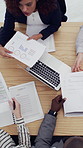 Above, hands and paperwork in office with laptop, project planning and data analysis for sales insight. People, documents and computer in meeting with business management, profit stats and proposal.