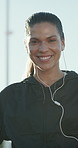 Face, runner and earphones for fitness in city with music, training and pride or podcast. Woman, break and streaming for sport exercise, workout playlist and endurance practice for health or wellness