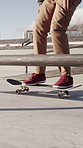 Skateboarding, ride and legs in park with practice, outdoor fun and balance skills in urban hobby. Sports, man and skater outside with movement, mobility training and board control in Los Angeles.