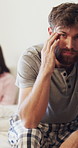 Stress, face and couple in bedroom with conflict for cheating, marriage fail or mobile message. Phone, man and woman in bed with toxic relationship, divorce or trust issues with portrait in home