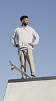 Ramp, man and thinking with skateboard outdoor for practice, training and extreme sports with action. Professional skateboarder, skatepark and African person with reflection, exercise and low angle