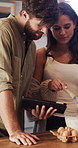 Couple, talk and baking in kitchen with tablet, online recipe and instructions for meal preparation. Married people, website and discussion in home with tech, method and ingredients for breakfast.