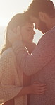 Sunset, outdoor and couple with holiday for connection, partner trust and relationship security in comfort. Calm, love and people with peace for marriage commitment, affection and support on vacation