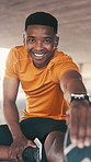 Face, fitness and stretching with black man outdoor for preparation or start of cardio workout. Exercise, smile and warm up with African runner on ground in city for balance, challenge or training