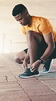 Fitness, start or black man outdoor with shoelace, ready or footwear safety in physical hobby. Secure, lace tie or athlete with sneaker, sportswear check or injury prevention in training preparation.