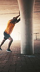 Balance, exercise and stretching with black man outdoor for preparation or start of cardio workout. Fitness, underground and warm up with African runner in city for breathing, challenge or health