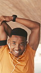 Earphones, exercise and face with black man stretching outdoor for preparation or start of workout. Fitness, music and warm up with happy African runner in city for balance or cardio training