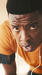 Outdoor, earphones and face of black man with breathing, cardio workout and fatigue for fitness training. Sweaty, exercise break and tired runner with exhale to recover, exhausted and streaming music