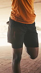 Fitness, hands and stretching legs with man outdoor for preparation or start of cardio training. Exercise, getting ready and warm up with runner person underground for commitment or dedication