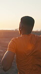 Fitness, running and black man outdoor in city for health, exercise or wellness by sunset. Sports, athlete and back of African person in urban town with cardio workout, active or training in evening.