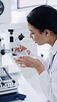 Scientist, phone and woman with picture in lab for medical sample, visual proof or post results. Science, mobile and person with photo for research, innovation and smile with evidence documentation