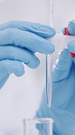 Hands, scientist and test tube with dropper in lab for chemistry, testing sample and research. Gloves, person and liquid for chemical reaction, medical experiment and biotechnology of cure innovation