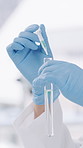 Science, dropper and hands with test tube in laboratory, medical experiment or clinical research trial. Pipette, scientist or person with gloves for chemical reaction investigation, liquid or testing