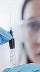 Scientist, healthcare and hands of doctor with syringe, drug and medical research for antivenom in hospital. Blood sample, needle and woman with test, innovation or venom protection for biotechnology