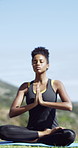 Lotus pose, yoga and black woman outdoor with calm, wellness and balance exercise by space. Breathing, prayer hands and African female person with meditation for calm, mindfulness or zen in nature.