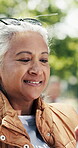 Reading, smile and old woman in park with tablet, post reaction and communication on email platform. Happy, bokeh and senior person in nature with tech, social media update and message on digital app