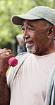 Fitness, class or old man in park with dumbbell, arm exercise or guidance in workout hobby together. Bokeh, senior people or coach with club, activity advice or group training in retirement.