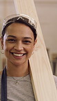 Face, woman and carpenter with plank at workshop for woodwork, manufacturing and handcraft. Portrait, female person and timber craft for furniture production, refurbishing wood and renovation project