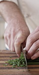 Cooking, kitchen and hands of chef with chives for gourmet recipe, meal prep and culinary service. Hospitality, food and person with ingredients for dinner, lunch or supper for catering business