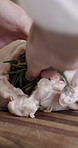 Person, hands or chicken with ingredients in kitchen for thanksgiving recipe or meal prep in home. Closeup, chef or getting ready with turkey stuffing for food cuisine, preparation or dinner in house