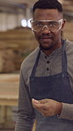 Face, black man and carpenter with goggles at workshop for woodwork, restoration and smooth surface. Portrait, male person and sanding for furniture production, refurbishing wood and polished finish
