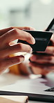 Business person, hands and phone with credit card for online shopping, banking or payment in office. Closeup, employee or shopper with debit, laptop or mobile smartphone for ecommerce or finance app