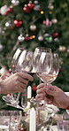 Christmas, cheers and hands of friends with wine for holiday, festive season and celebrate together. December, bonding and happy people with wine toast for xmas party, dinner or tradition in backyard