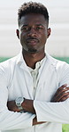Outdoor, black man and face in nature with arms crossed, confidence and career growth as ecologist. Male person, employee and environment specialist for field research, job opportunity and experiment