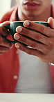 Hands, creative and person with coffee in office for caffeine start, morning routine and wellness. Man, cup and employee with warm beverage, espresso drink and work break in workplace for breakfast