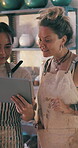 Scroll, pottery or team in store with tablet, creative insight or stock control in clay shop. Partnership, women or owners with tech, inventory management or design planning in ceramic business.